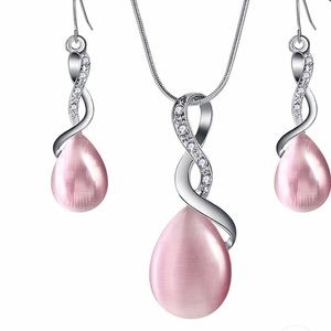 Crystal opal cross necklace and earrings